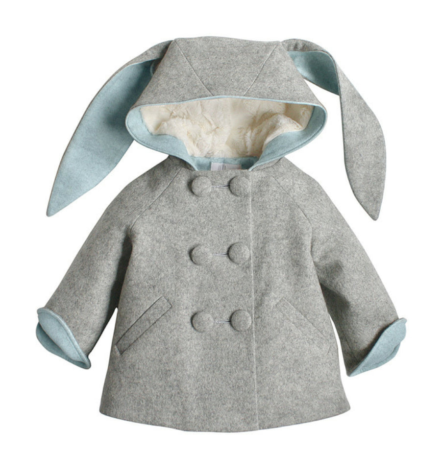 light grey coat with bunny ears on the hood and white lining within the hood. The body is completed with light blue lining and six grey buttons, in pairs, down the front.