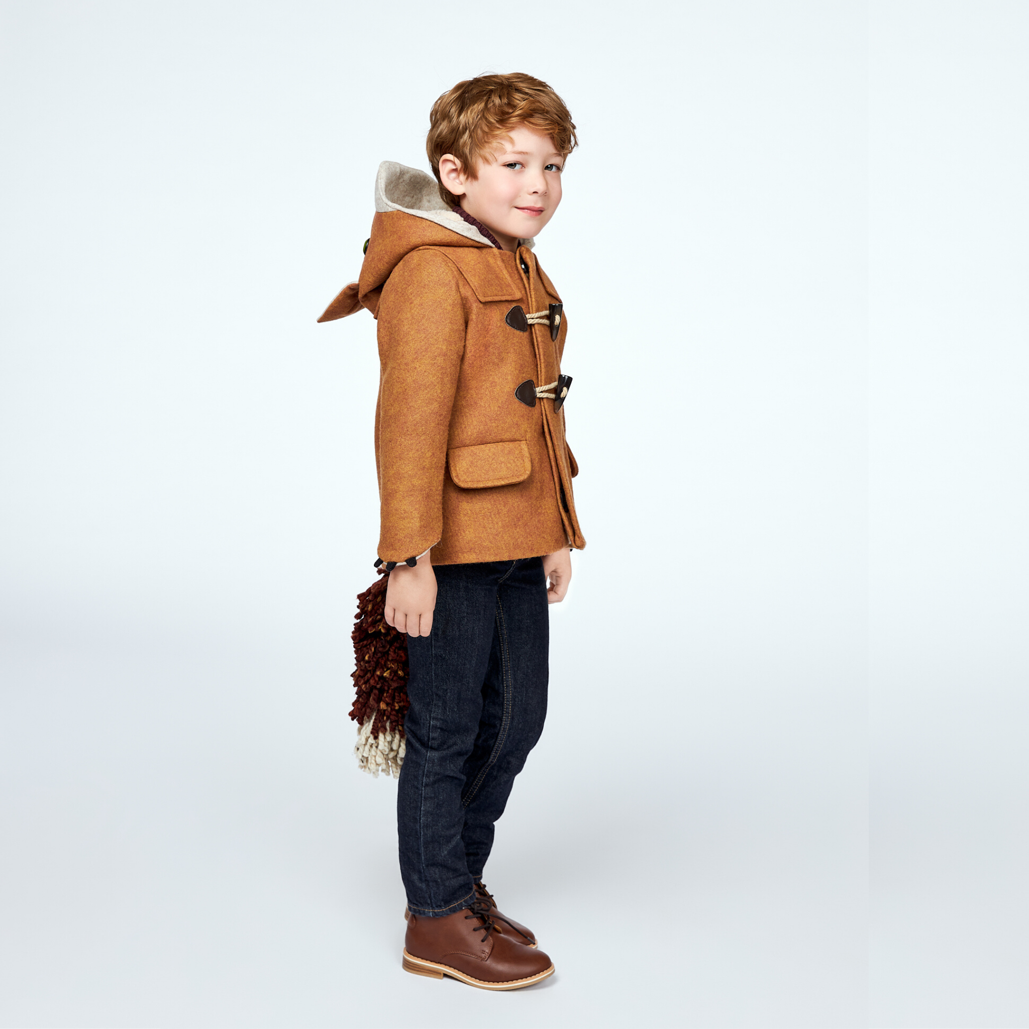 Child wearing Little Goodall Luxe Fox Coat with fox hood, toggles, and detachable tail