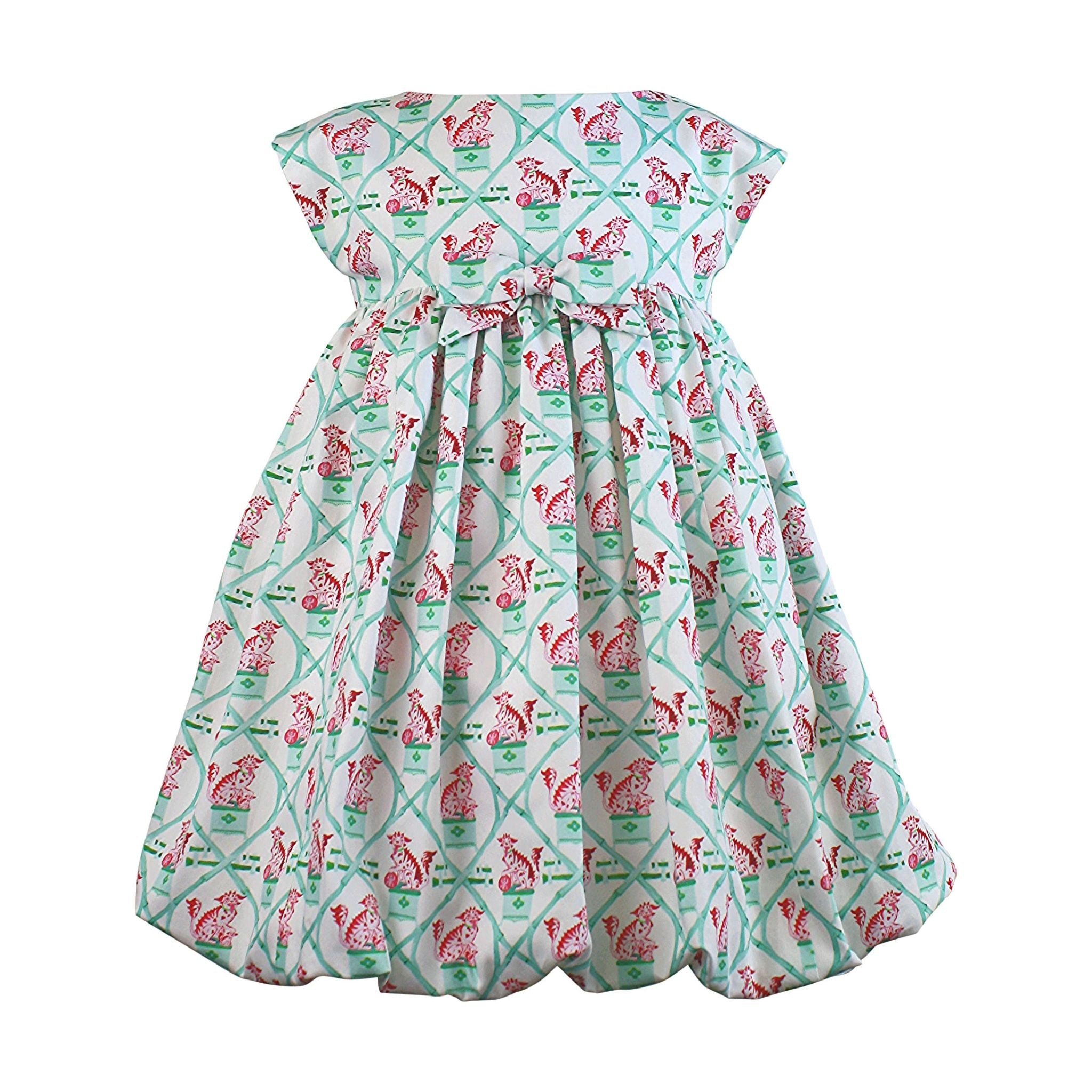 Mint-colored girls' dress with a carrot and dot pattern, cap sleeves, and a gathered balloon hem