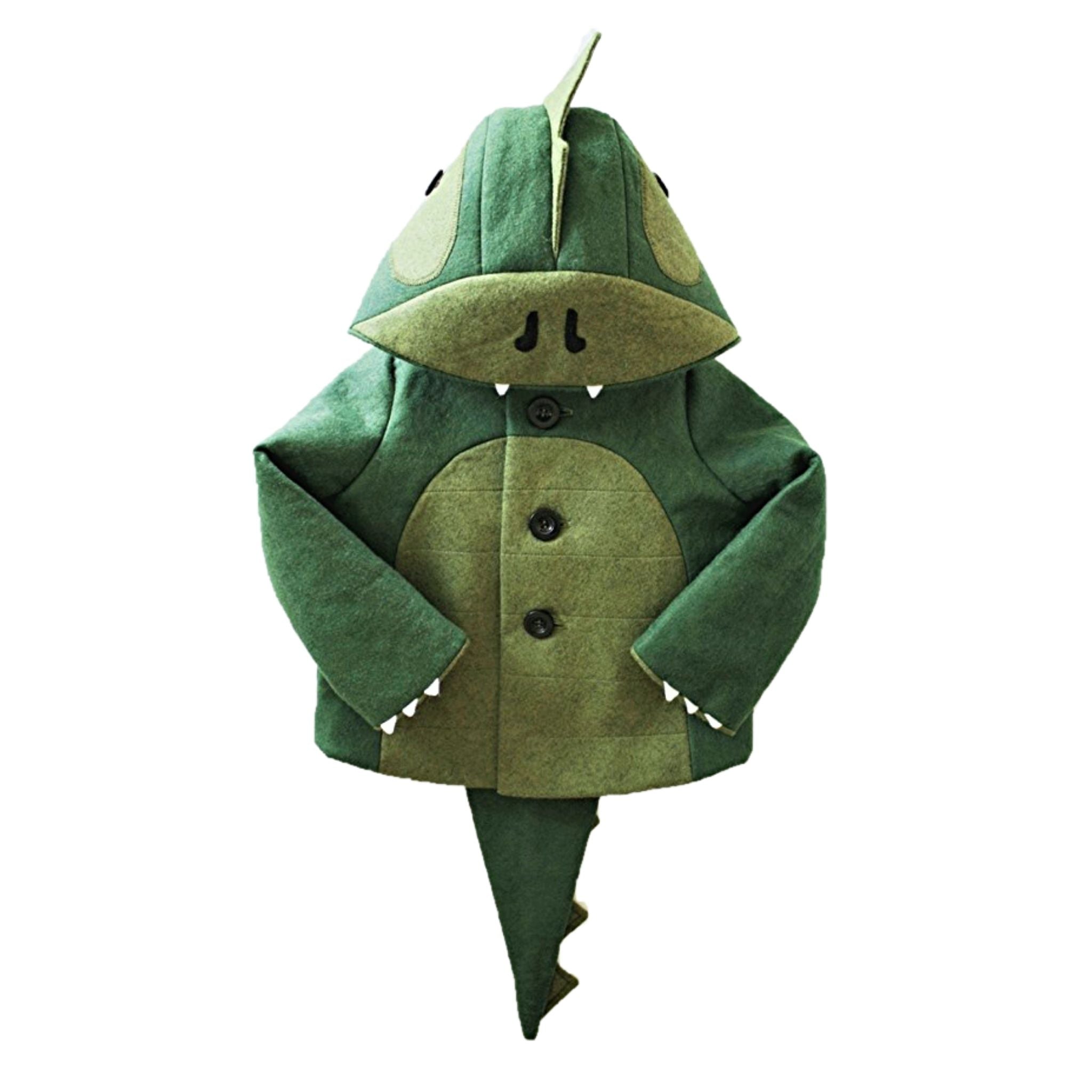 Front view of the Cheeky Green Dinosaur Coat, a wool-felt kids' jacket with a ridged hood, plush lining, clawed sleeves, and a long tail.