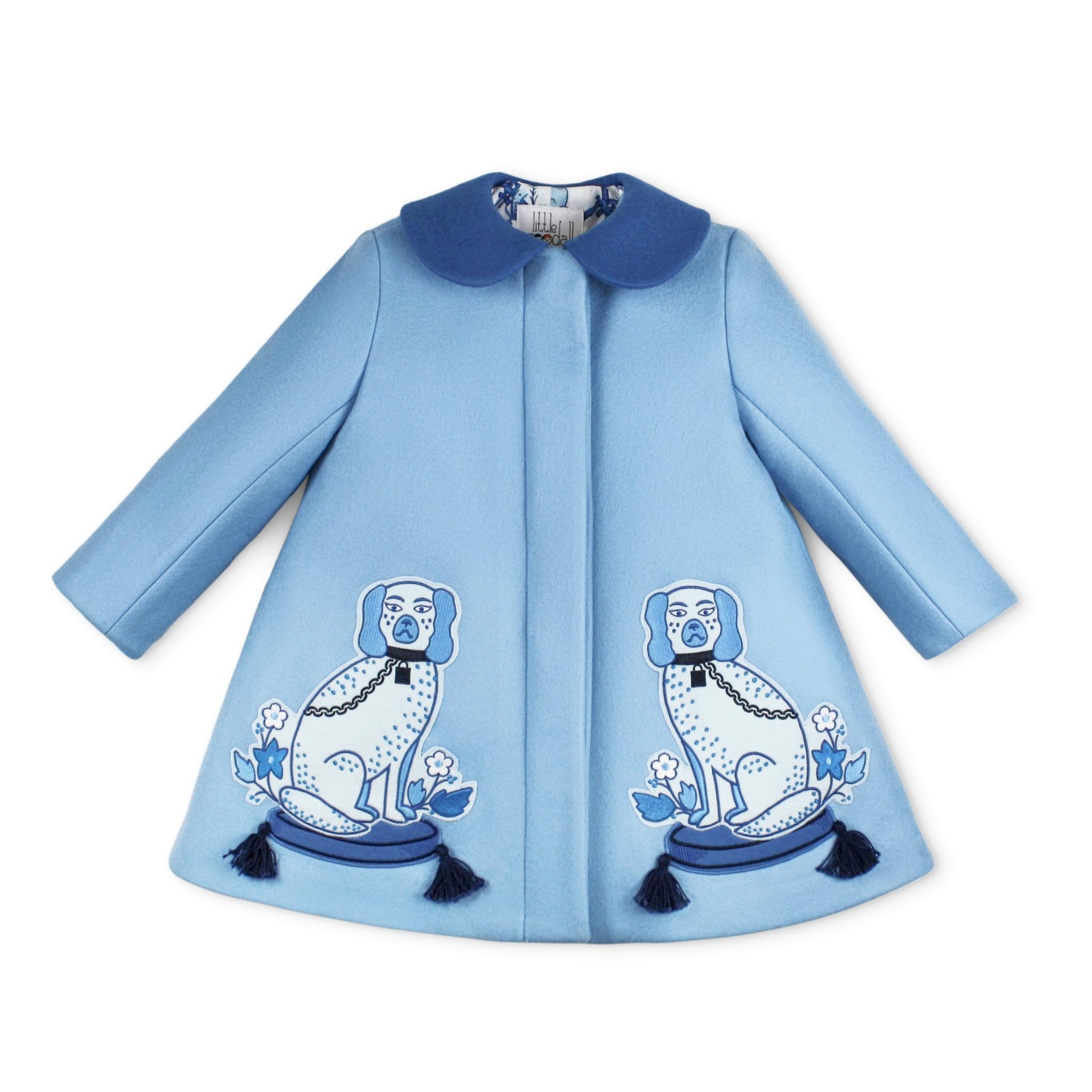 Light blue wool girls' coat with embroidered Staffordshire dog motifs, tasseled pillows, and a satin lattice lining, from Willa Heart collaboration