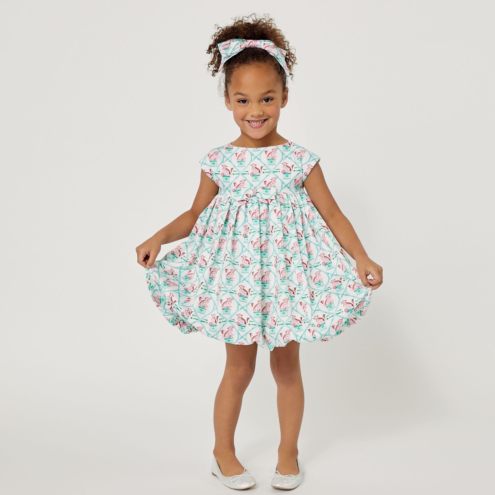 mint dress with a carrot trellis pattern, cap sleeves, and a gathered bubble skirt