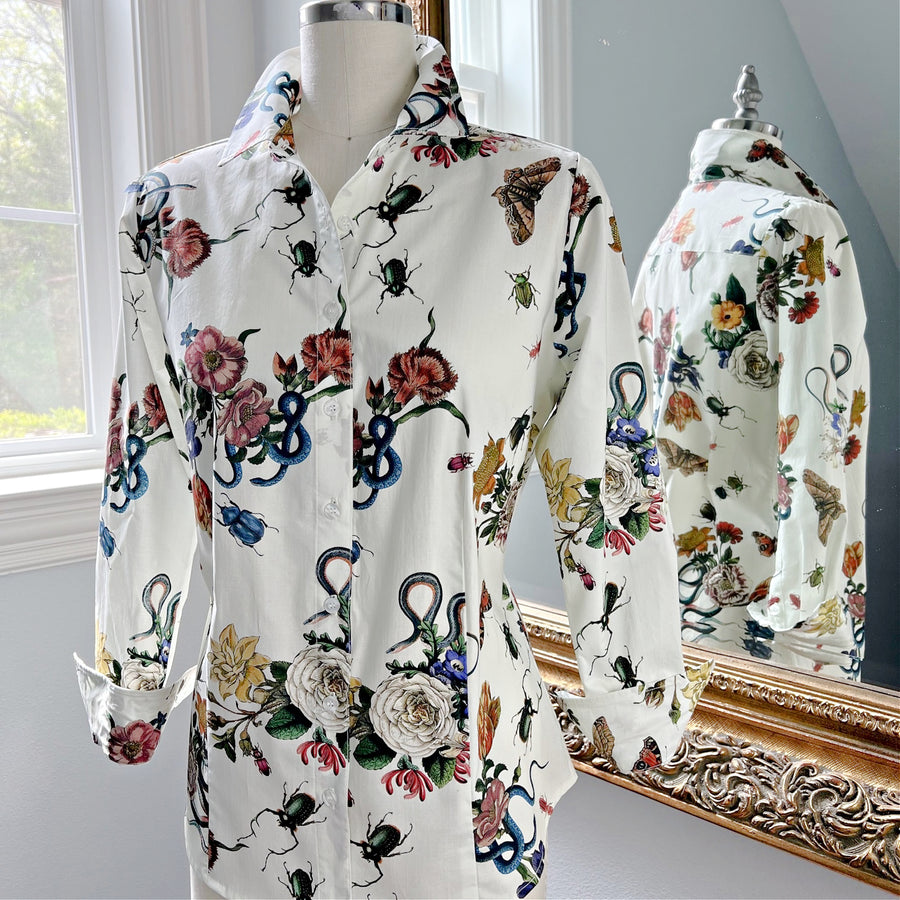 Ivory Botanical Ladies Shirt on form, showcasing its elegant floral, butterfly, and beetle print on soft cotton sateen with a button-down front and tailored fit