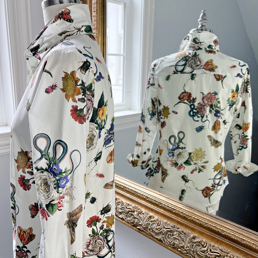 Side and back view of the Ivory Grand Botanical Ladies Shirt with a floral, butterfly, and beetle print on cotton sateen, featuring a structured collar