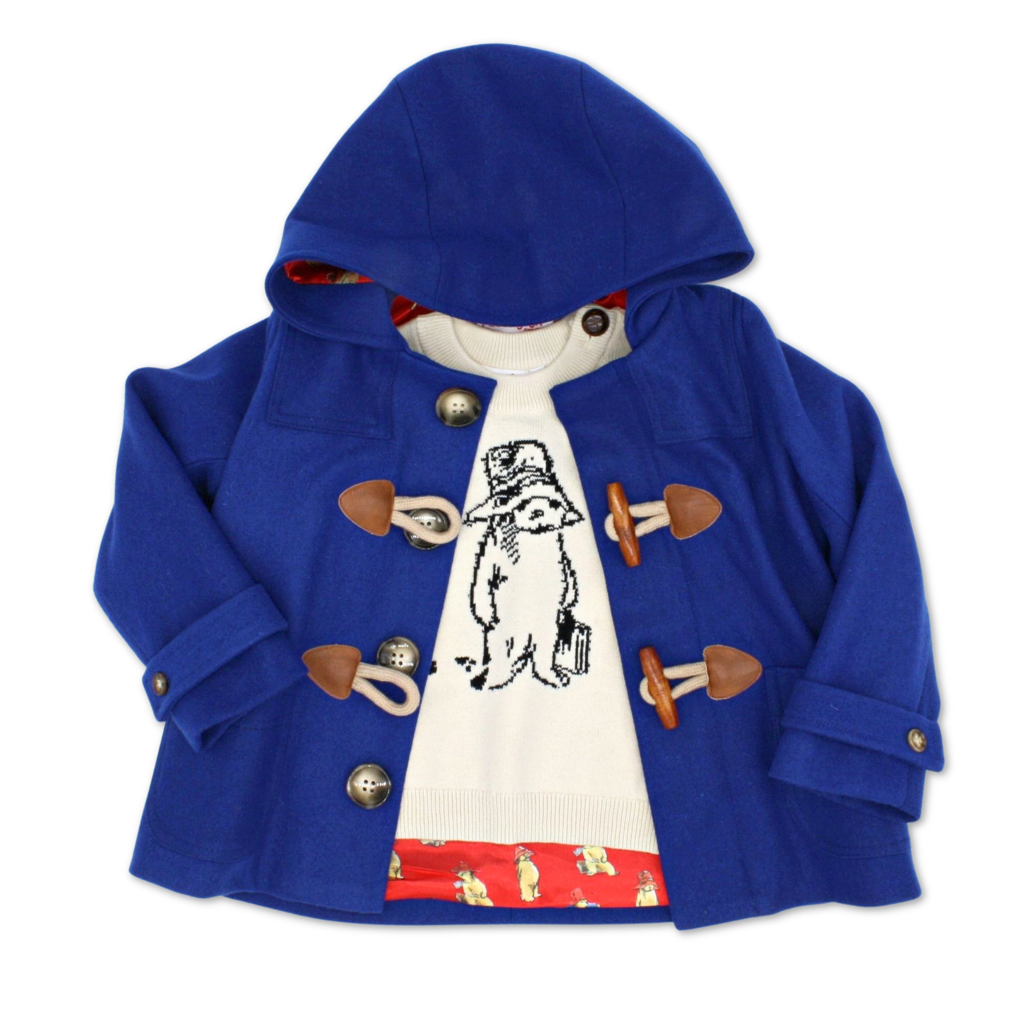 kids n Bear Sweater in ivory, featuring a black knit Paddington Bear illustration, layered under a classic blue duffle coat with toggle closures