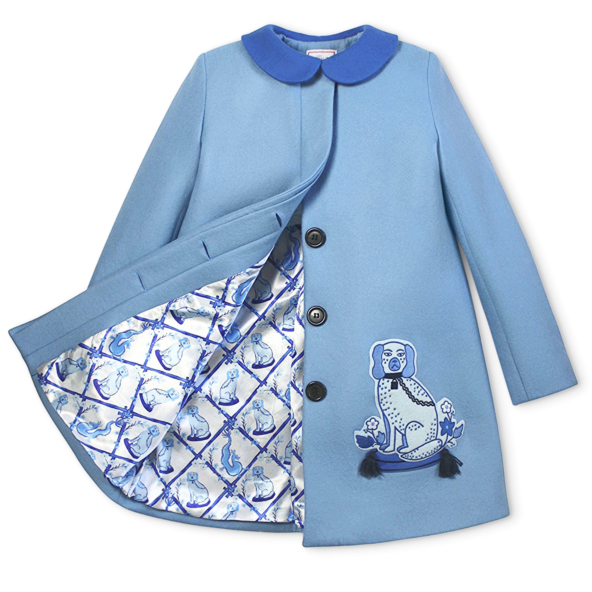 Ladies Aldrich and Madame De Bleu Coat in merino wool, featuring a satin lattice-print lining with blue dog illustrations and detailed embroidery