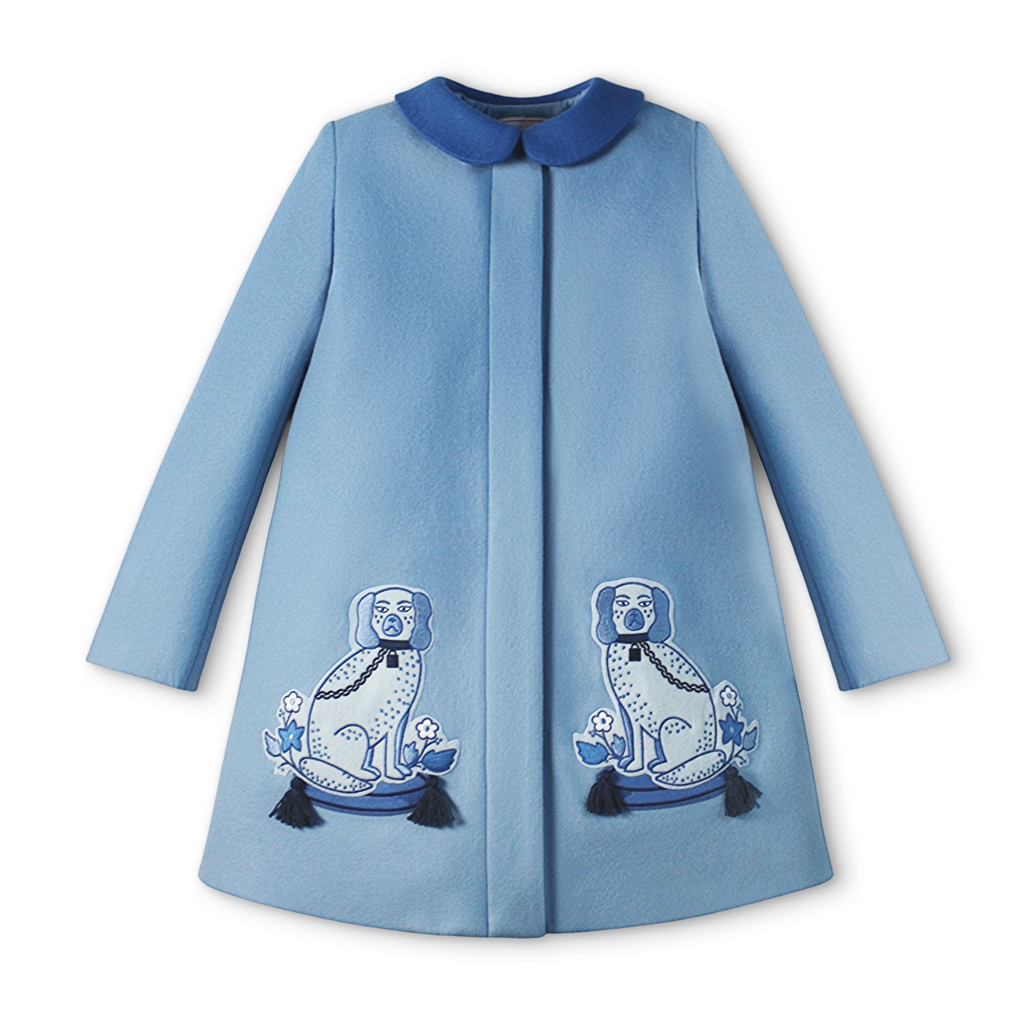 Ladies Aldrich and Madame De Bleu Coat in soft blue merino wool, featuring elegant hidden buttons and embroidered dog motifs with tassel accents