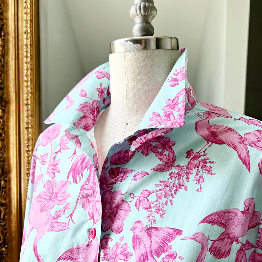 Elegant cotton sateen shirt with pink bird and floral print on blue fabric