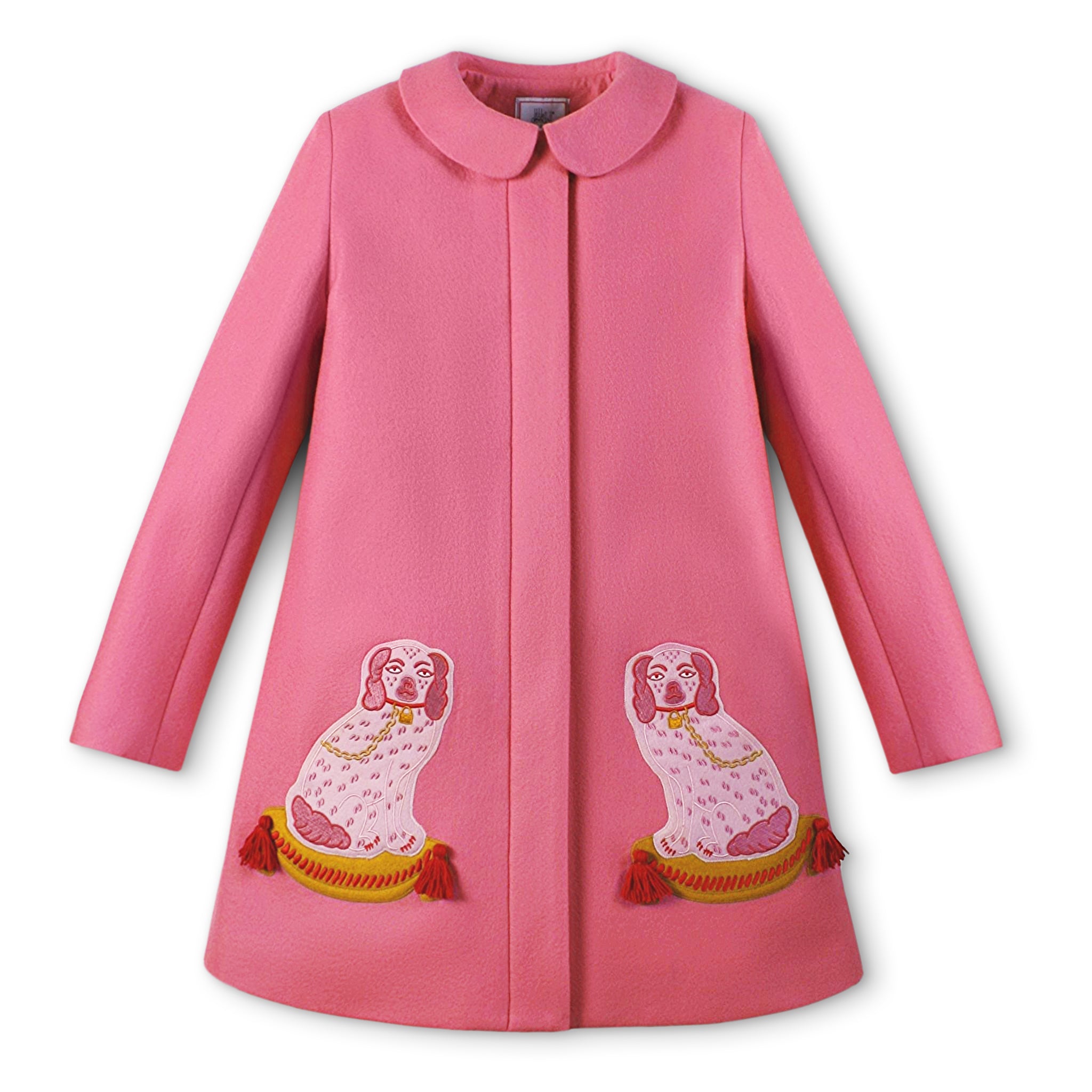 Pink merino wool A-line coat with two embroidered dog motifs on tufted pillows, hidden placket, and a Peter Pan collar