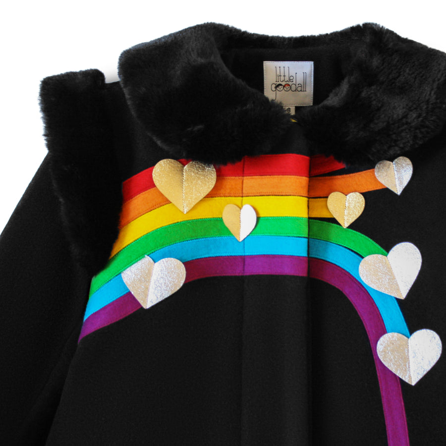 Close-up of the Ladies Queen of Hearts Coat, showcasing the rainbow applique, silver and gold hearts, and plush faux fur collar.