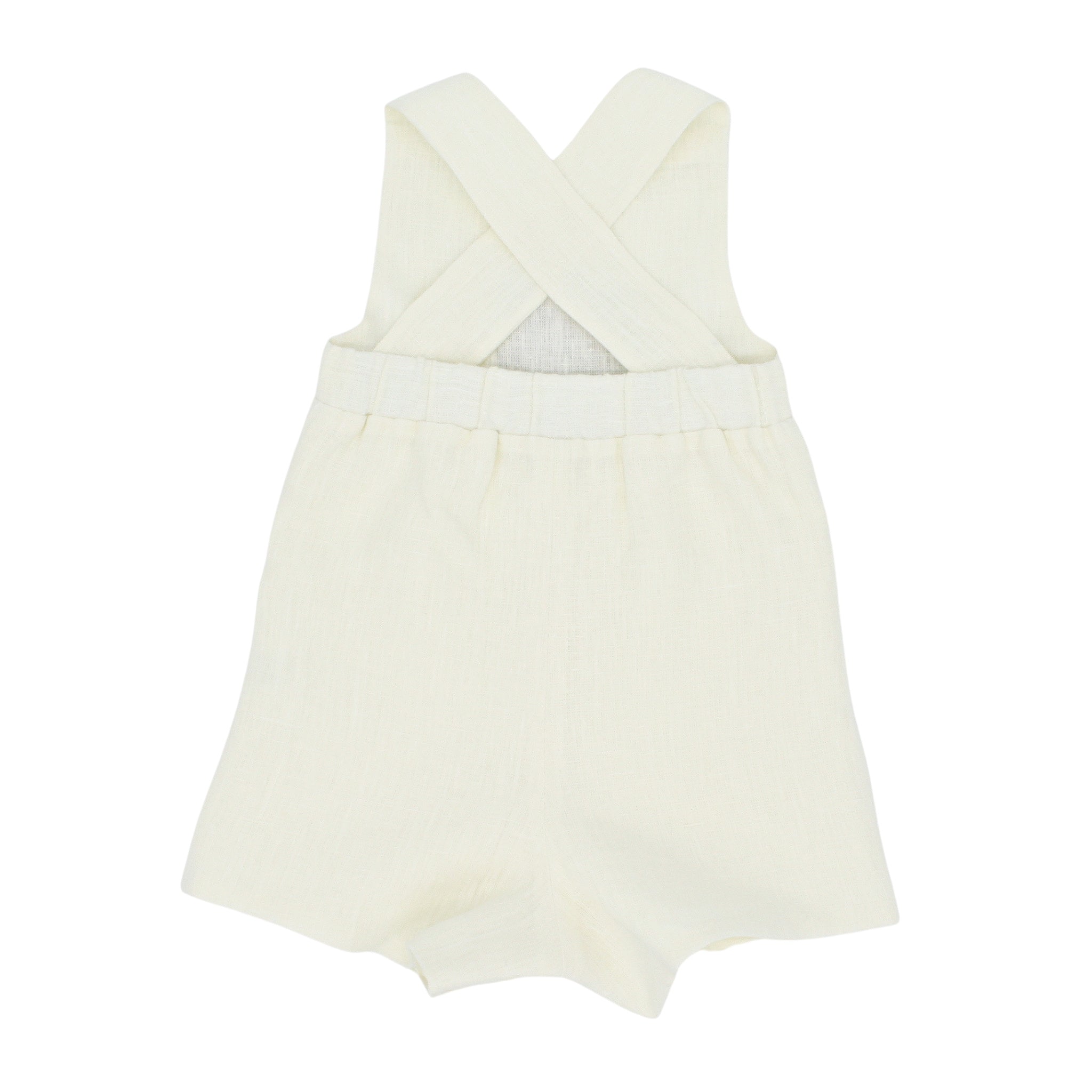Little Goodall Back view of ivory linen bushel bunny romper with crisscross straps and elastic waistband