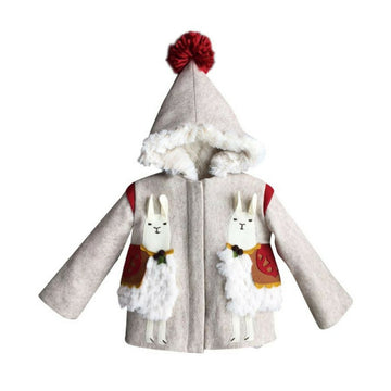 Front view of the Little Goodall Lucky Llama Coat, a beige wool jacket with faux fur trim, red pom-pom hood, and playful llama appliqués.
