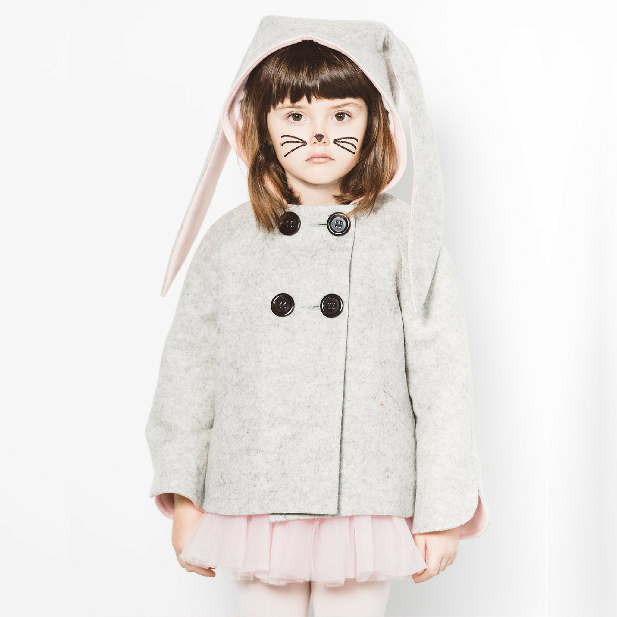 Grey wool bunny coat with pink-lined ears, cozy faux fur lining, and large buttons for easy wear