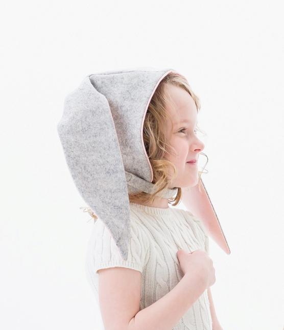 Close-up of a child wearing the Little Goodall Luxe Grey Bunny Hat, showing soft grey fabric with pink-lined floppy ears