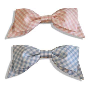 Set of large pink and blue gingham hair bows with secure alligator clips, handmade for girls.