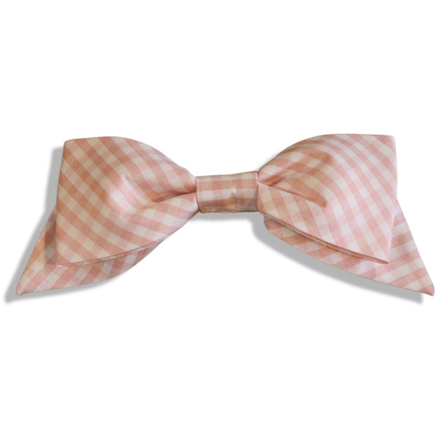 Pink gingham hair bow with an oversized design, handmade and attached to a secure alligator clip