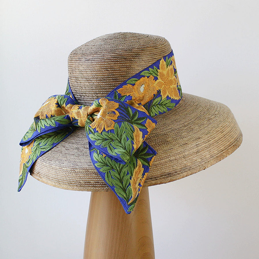 Close-up of French blue embroidered bow on Audrey Sunflower straw sun hat