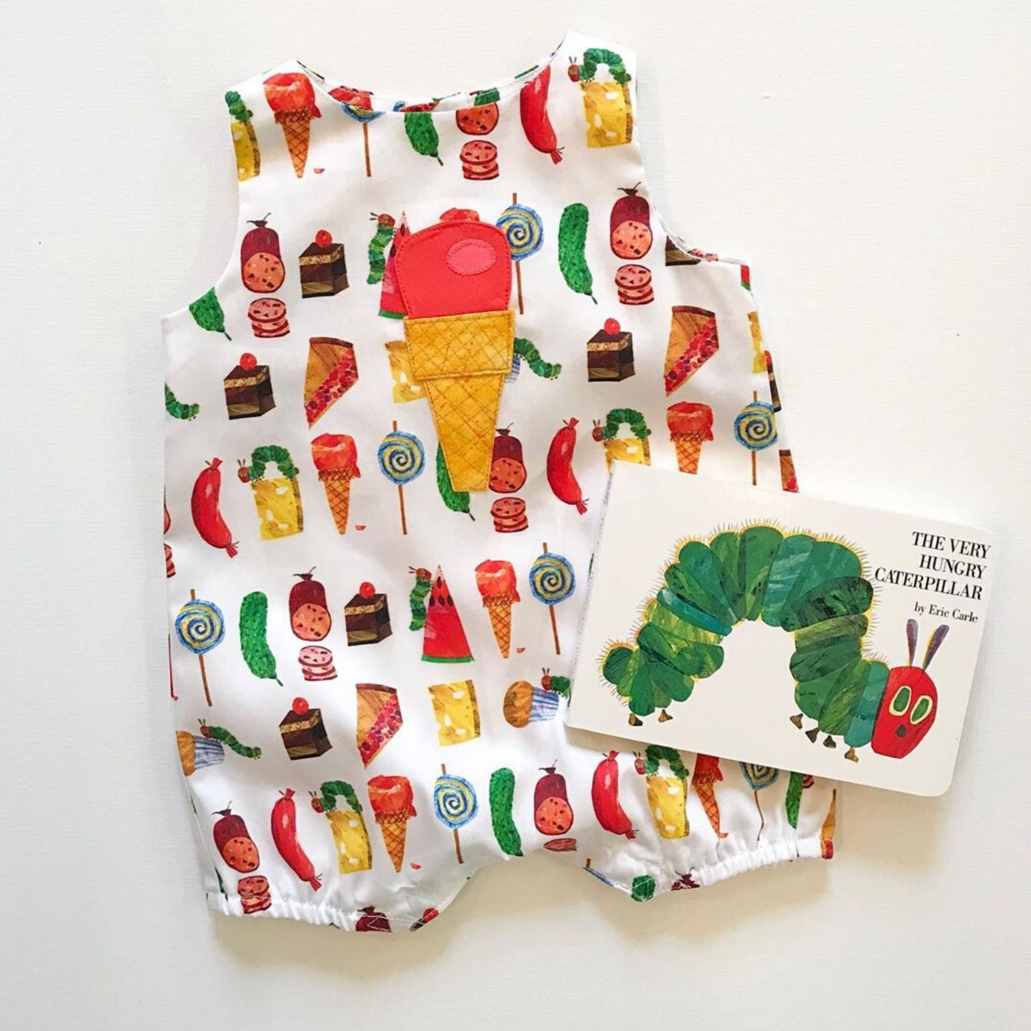 Very Hungry Caterpillar One Scoop Romper with appliquéd ice cream cone, paired with the classic book. A sweet baby and toddler gift idea