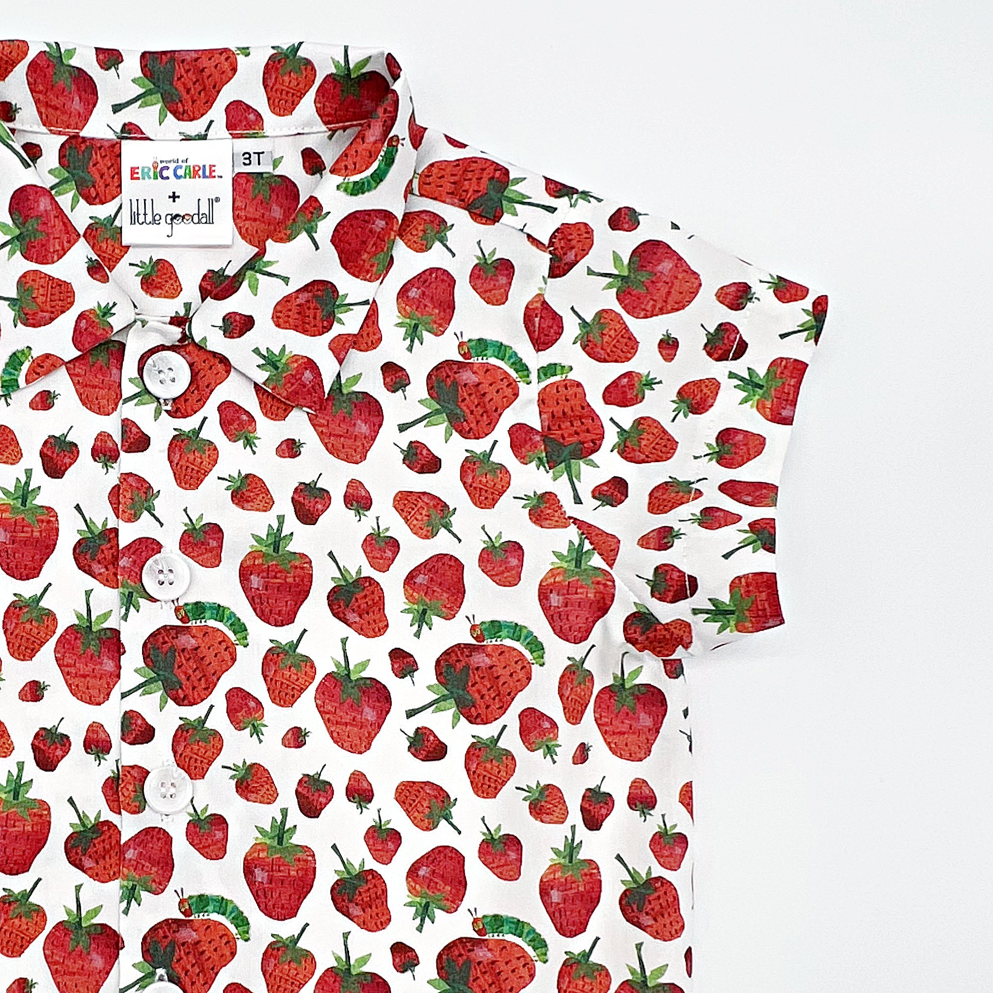Close-up of a kids' strawberry print button-up shirt featuring The Very Hungry Caterpillar™ design 