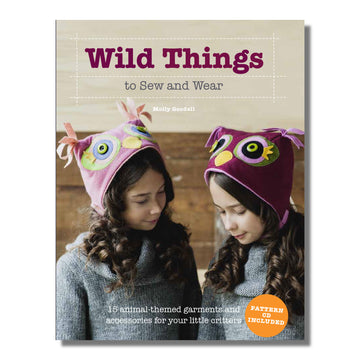 Cover of "Wild Things to Sew and Wear" book featuring two children wearing handmade owl hats, showcasing animal costume patterns by Molly Goodall.
