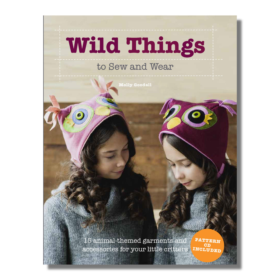 Cover of "Wild Things to Sew and Wear" book featuring two children wearing handmade owl hats, showcasing animal costume patterns by Molly Goodall.