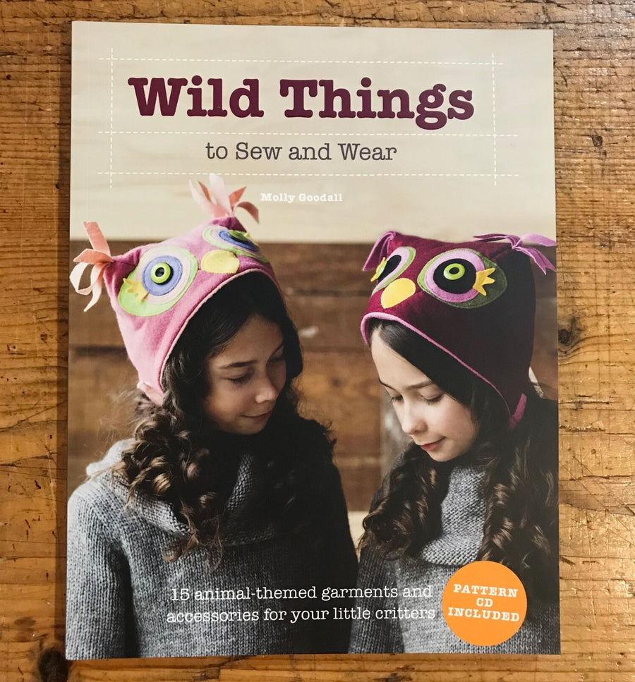 Cover of "Wild Things to Sew and Wear" book featuring two girls in owl hats